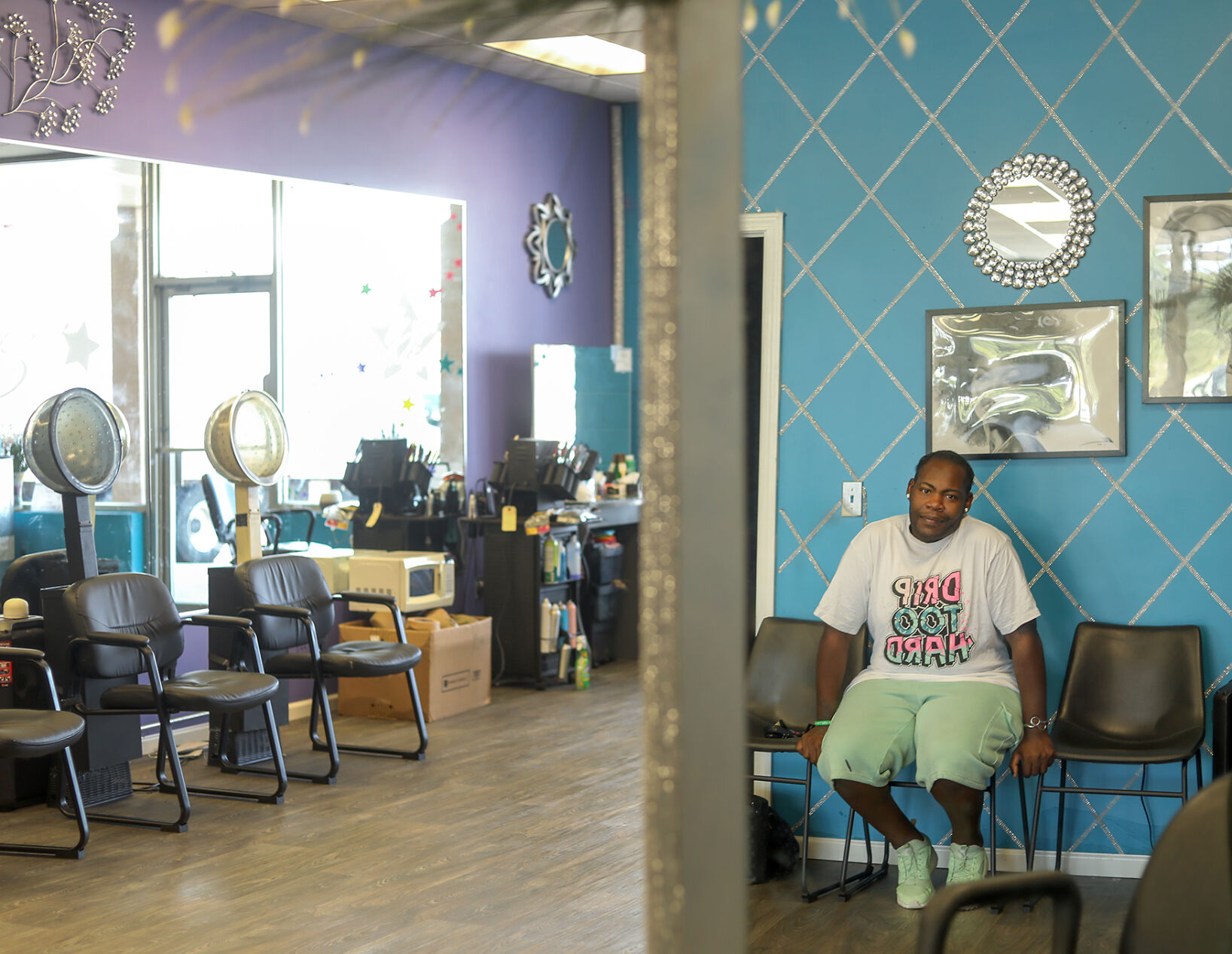 Peoples’ Defense founder Roy Lovelady gazes into a mirror